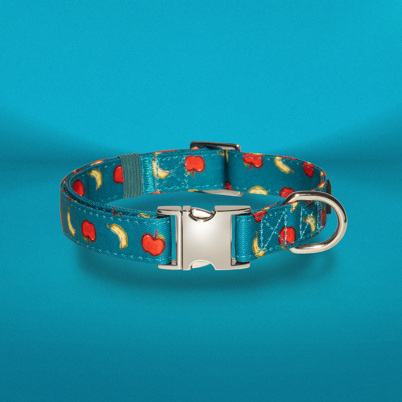 Banapples dog collar in teal with apple and banana print, buckle detail