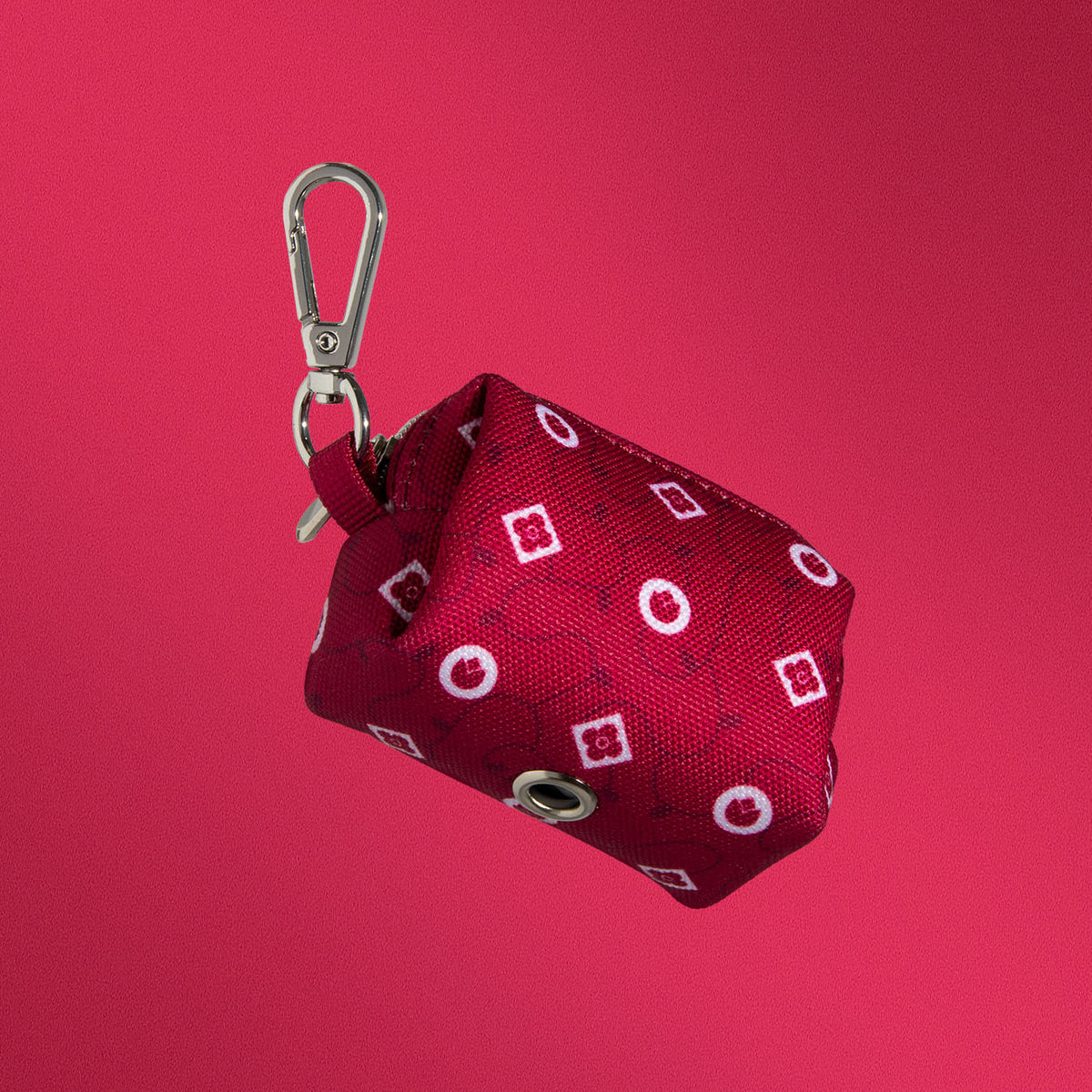 Dandy Dame waste bag holder close-up of crimson monogram print
