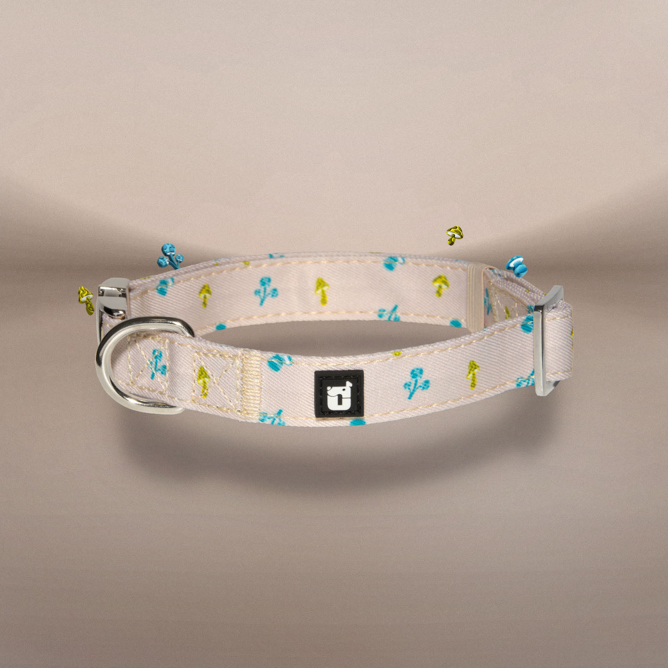 Mini Mushies dog collar in beige with teal mushroom print and silver hardware | One of Us