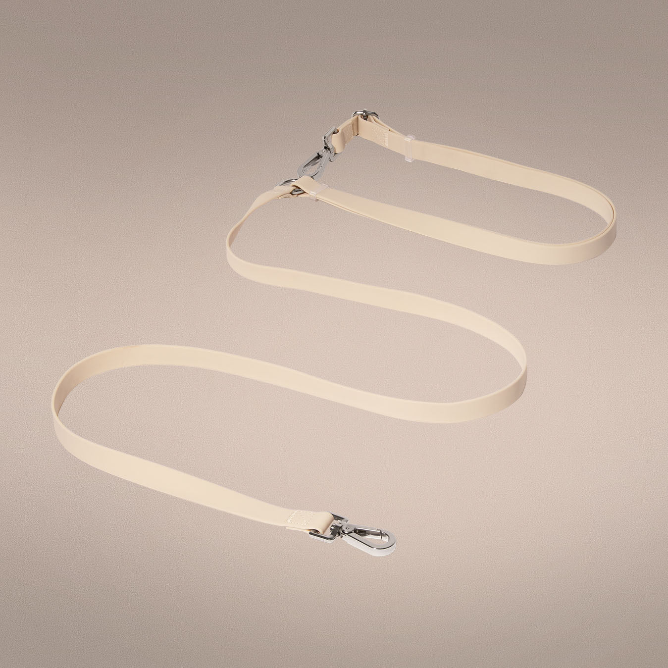 Mini Mushies hands-free leash worn crossbody in beige | One of Us